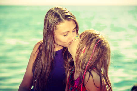Mother and daughter lesbian kiss